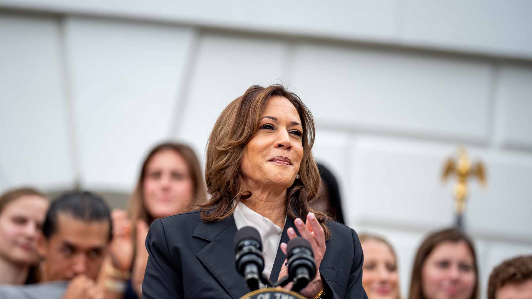 Kamala Harris at podium.